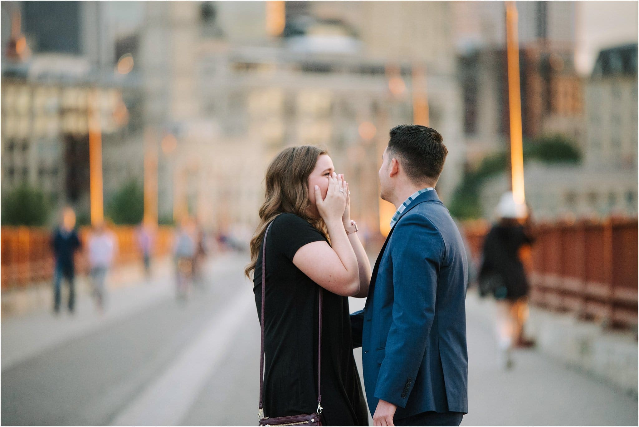surprise proposal on stone arch bridge minneapolis