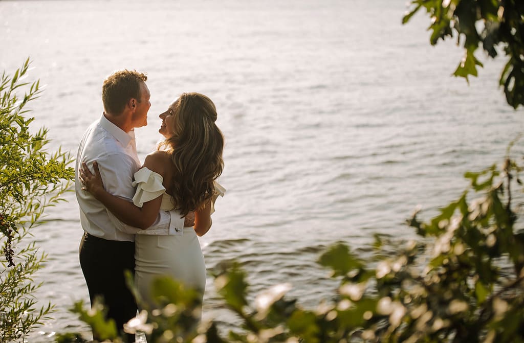 lakeside bride and groom at sunset elopement