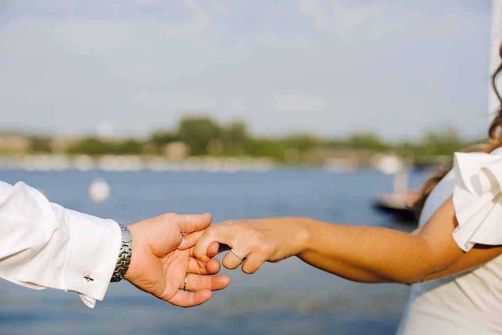 detail of rings on newlyweds' hands