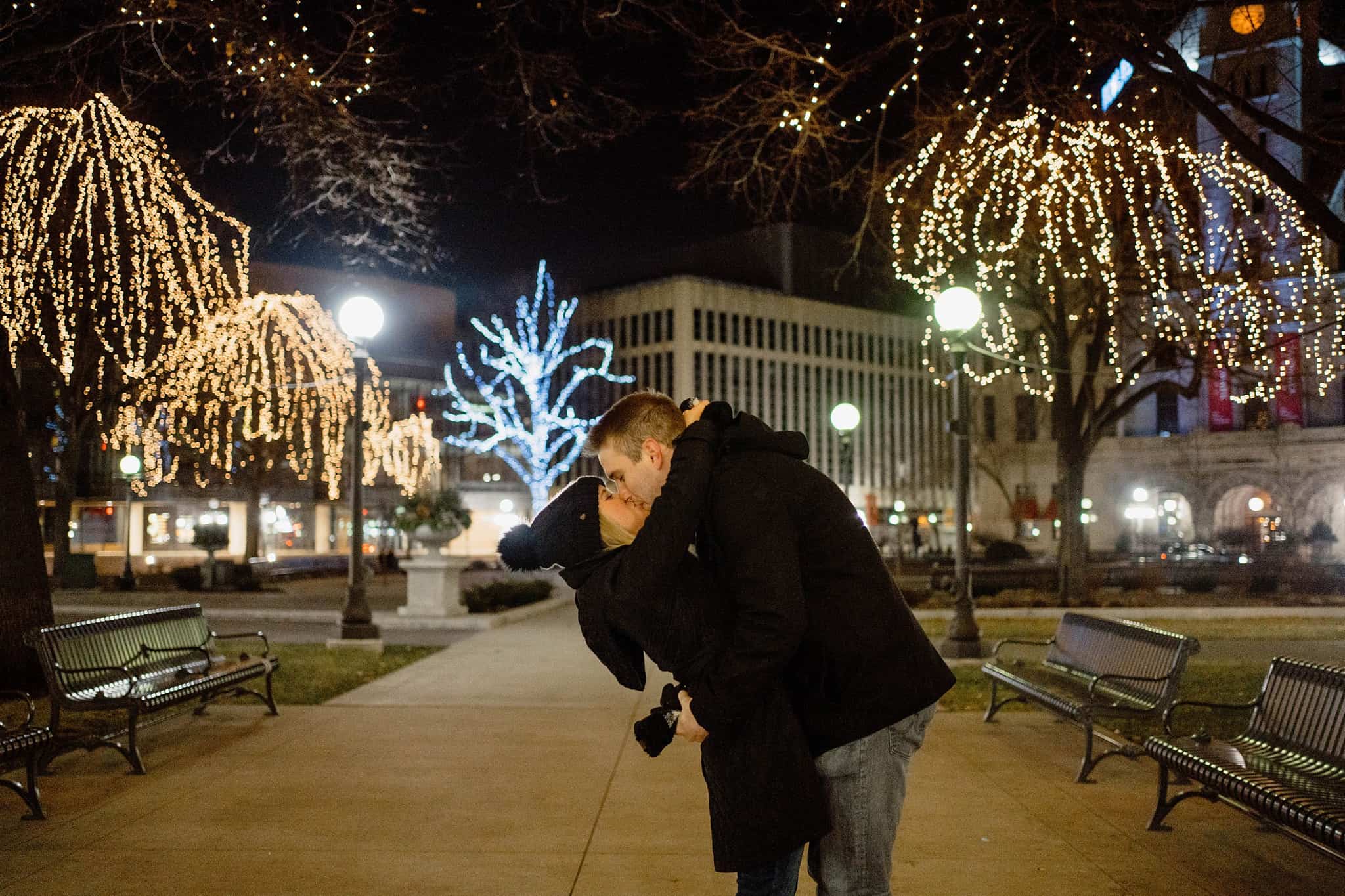 newly engaged couple kisses in rice park